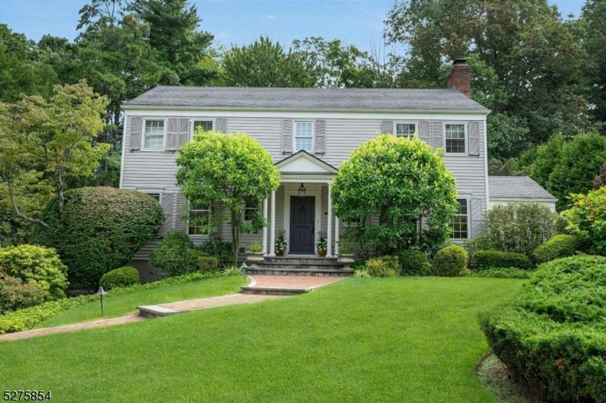 Welcome to this handsome Colonial sitting on a .38 acre private park-like lot located in The Highlands section of Summit . A recent expansion comprises a spacious eat-in Kitchen with large center island and direct access to the rear patio through french doors with phantom screens.  Above, the luxurious  Primary Bedroom with views of the yard boasts a lounging area with fireplace, a primary Bath with oversized shower and custom vanity, and a walk-in closet.  The convenient floor plan ensures easy interaction between the spaces drenched in sunlight thanks to oversized windows and doors. The yard provides plenty of space for outdoor activities and entertainment.  Special features include 2 zones heat and AC, a heated 2 car garage, a first floor office, and 2 gas fireplaces.