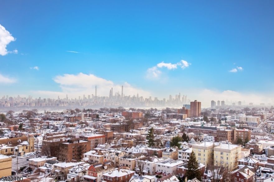 Welcome to the Greenhouse, where luxury meets comfort. Enjoy this breathtaking unobstructed panoramic view of the NYC skyline. Imagine waking up and going to bed watching this view every day? This beautiful 19th floor condo unit offers open large floor space offering 1,122 sq ft of living space with a new renovated kitchen, bathrooms and flooring. Bedroom is spacious with walk-in closet and full bathroom, large living room, dining area open to kitchen w/plenty of cabinets and brand new wine cooler, space off the living room for office and powder room. This largest one bedroom unit is freshly painted with lots of updates throughout. Laundry room on same floor, coin/card operated. Tandem TWO car garage (unique for this unit). The building's amenities include: Outdoor pool and hot tub, newer basketball court, full gym, recreation room, lobby and 24/7 security. Just unpack and welcome home...