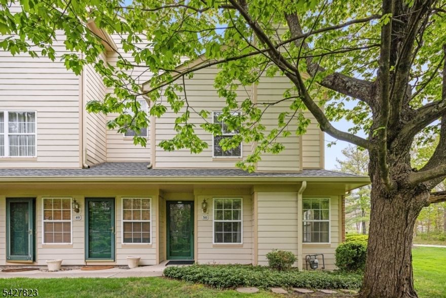 Welcome to this rare corner-unit townhome in a sought-after luxury community offering the perfect blend of style, comfort, and convenience. Meticulously maintained with select updates, this home features an open-concept living and dining area, a cozy gas fireplace, and expansive windows that fill the space with natural light. A private Trex deck overlooks the scenic Loantaka Brook Reservation walking/bike path, creating an ideal outdoor retreat.The main level offers easy living with a spacious primary suite featuring a walk-in closet and full bath, a second bedroom, additional full bathroom, well-appointed kitchen, and separate laundry room with access to the attached one-car garage and driveway parking.The expansive lower level spans the full length of the home and offers two versatile open spaces perfect for a home office, gym, playroom, or additional living area, plus generous unfinished storage area.Residents enjoy highly desirable amenities including a fitness center, tennis courts, clubhouse, and outdoor pool. Ideally located near two train stations with direct service to New York City, major highways, and the vibrant downtowns of Morristown, Madison, and Chatham for dining, shopping, and entertainment.