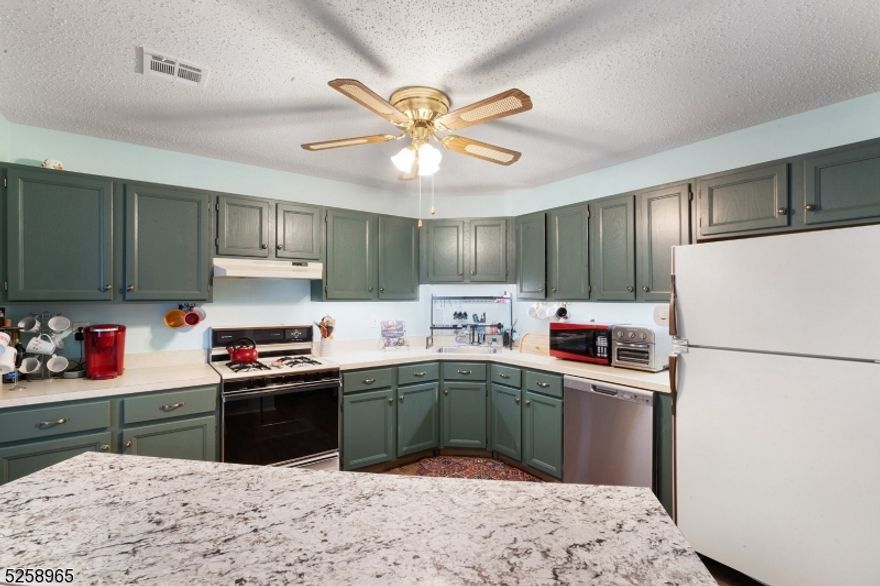 You must see this freshly painted second floor unit with luxury vinyl plank throughout this spacious 2 bedrooms and 2 bathrooms on second floor. Living room, kitchen, and dining room offer open floor plan with extra counter space. Primary bedroom features on suite bathroom and with large closet. Laundry room located in home plus 1 car garage for ample storage. Very convenient location: 1 minute to RTS 10, 46 & 80 NJ/NYC transit as well as convenient to a variety of shopping malls. No smoking / vaping.