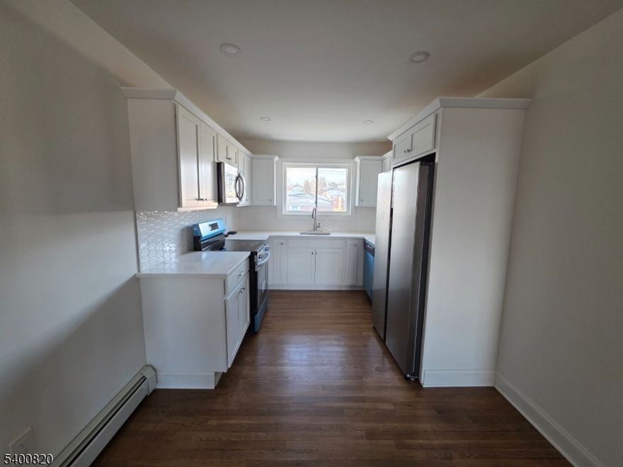 Move right in to this completely renovated one bedroom condo.  All new eat-in kitchen with dishwasher and stainless appliances. Hardwood floors throughout, lots of closet space.  Heat, water and sewer included. Laundry and storage in basement. Close to town and transportation.