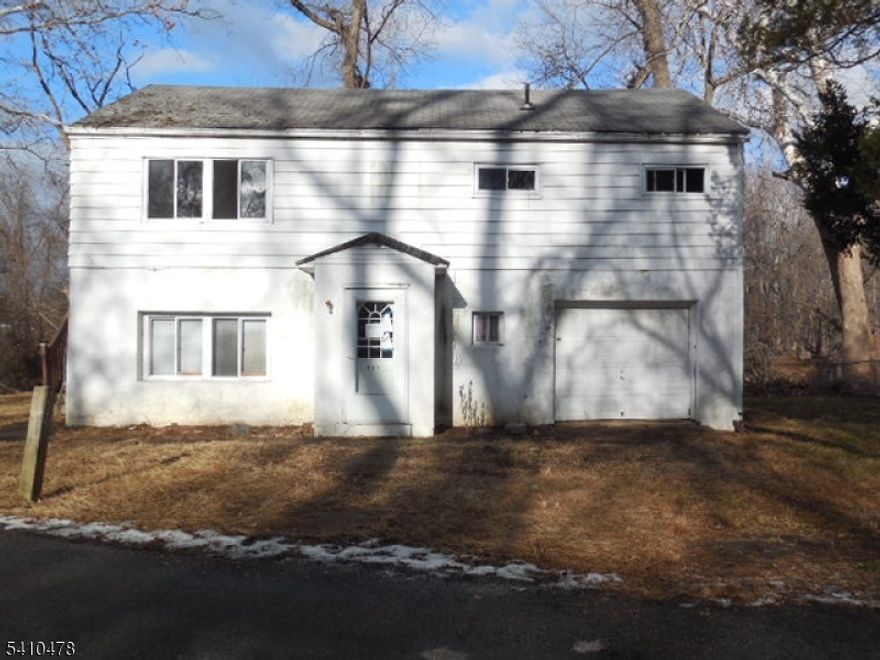 Cape Cod style home in average condition on the exterior with maintenance free siding and a 1 car attached garage located on a quiet dead end street. 4 bedrooms & 2 full baths. Interior needs to be completely gutted due to mold. Home currently has a septic system but there is public sewer in the street & gas in the street. Property is being sold in absolute "as is" condition all town required inspections are responsibility of the purchaser as well as all final water & sewer bills. Use caution when entering flooring on the 1st floor is uneven also where a mask due to mold. Property will require flood insurance.