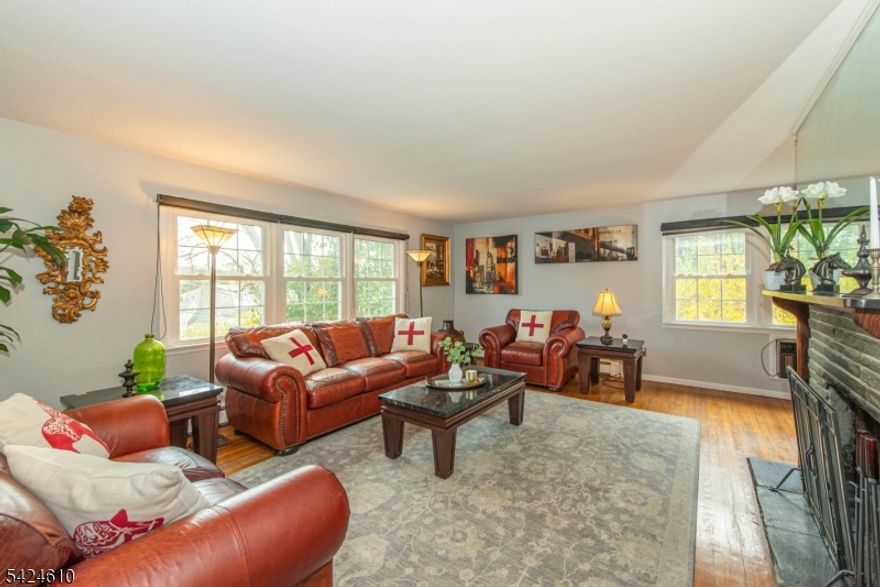 Experience lake living in this beautifully updated raised ranch in the heart of Lake Mohawk, near relaxing Upper Lake beach and close to local shops and dining. A world away, with quick access to commuter routes makes this the ideal location. The flexible layout offers options to fit your needs. The lower level features a spacious entry-level room  plus a full bath ideal for a private guest suite, family room, or home office with direct access to the one-car garage plus a large, fully fenced backyard perfect for entertaining, play, or pets. Upstairs, natural light fills the main living spaces. A bright living room flows into the updated eat in kitchen with modern finishes including cherry cabinets, granite countertops and stainless appliances, with plenty of room to gather,. The sunroom provides a peaceful, light filled retreat to enjoy the changing seasons. Three generously sized bedrooms and a beautifully renovated full bath complete the upper level. Offering up to four bedrooms (3 bedroom septic) and thoughtful updates throughout, this home blends comfort, versatility, and location in one of Lake Mohawk's most desirable settings. Natural gas available in the street.