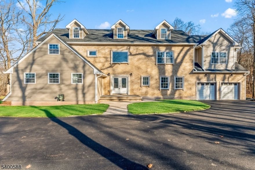 Stunning New Construction | 4,000+ Sq Ft | 5BR | 3.5BA Newly constructed on an existing foundation, this impressive 4,000+ sq ft home offers exceptional space and modern design. A dramatic two-story foyer welcomes you into a layout featuring wide-plank hardwood floors throughout. The gourmet kitchen includes a 36" six-burner range, oversized center island, walk-in pantry, and opens to the dining room with built-in buffet?ideal for entertaining. First-floor bedroom and full bath provide flexible living options, plus a convenient mudroom off the garage. Upstairs features a loft, laundry room, and generously sized bedrooms with large closets. The private primary suite offers dual walk-in closets, spa-like bath with stall shower, and a balcony overlooking the deck and park-like yard. Walkout basement with third garage bay and finishing potential. Highly rated schools. Close to shopping and transportation. Photos digitally enhanced. Taxes not yet assessed.
