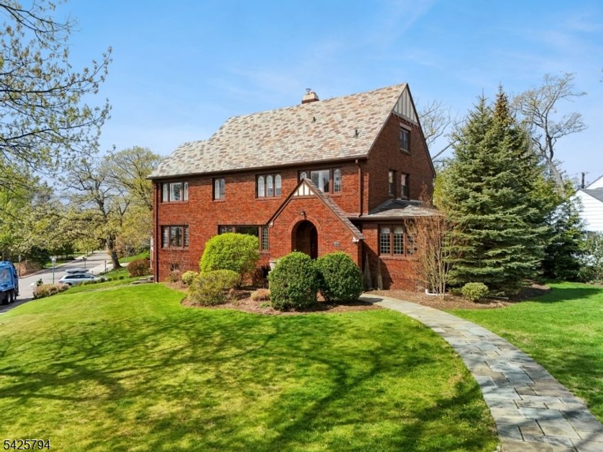 Nestled in the coveted Newstead neighborhood, this stunning 5-bedroom, 3.1-bath home exudes timeless charm and modern comfort. Step inside to discover a sunlit interior, where expansive living spaces flow seamlessly.The heart of the home is a chef's kitchen, with high-end appliances, ample counter space, and stylish finishes. Adjacent to the kitchen is a cozy family room. A gracious dining room opens to the covered porch, and a spacious living room with a fireplace provides the ideal backdrop for both everyday moments and special occasions. Completing the first floor is a bedroom, a full bath, a half bath, and an office. Upstairs, the large primary suite boasts an en-suite bathroom, a walk-in closet, and breathtaking views. Three additional bedrooms are serviced by the main bath with separate tub and shower. The third floor is a massive great room-perfect for a rec room, media lounge, or a flexible living area.The lower level has a laundry area, ample storage, essential utilities, and an attached heated two-car garage.Outside, the backyard is a true oasis with a patio for alfresco dining and lush green space for gardening or play. Near parks, shopping, dining, and recreation, this location offers year-round entertainment including a lively block party!  2 blocks to NYC jitney train service. Enjoy seasonal NYC skyline views. House has an underground sprinkler system and 2 zone CAC.