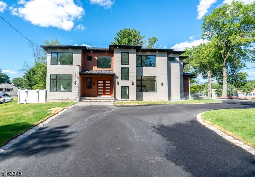 Take advantage of builders' extended rate from July 7th prog w/ its preferred lender & get ready to move in before September. Design & built by renowned local luxury builder "NJGCB'', Modern new construction w/ 5000 sqft of finished living space in the desirable Broadlawn section of Livingston, NJ. This stunning smart home features 10 yrs of builders warranty, double height foyer, floating staircase w/ Red Oak trades & cable railing, 18 feet high ceiling in family room w/ skylight, FLR& DR,  Den w/gas FP & Sliding Doors leading to Patio overlooking landscaped bkyd. First fl Guest Suite w/BD & Full BA. Chef's Kit w/High End SS Appl, Quartz countertop, Custom Modern Black Cabinetry, Wine Frig, Large Center Island & Butler Pantry w/custom shelves & glass doors. Office rm, Mudrm & Powder Rm completes 1st fl. Primary Suite w/high ceilings, drop ceiling, Spa Bath Retreat & 2 Large custom WIC's. Add'l Three Secondary BD, 1 En Suite, 2 extra Bath & Laundry Rm completes 2nd fl. Full Finished Bsmnt walk-up to bkyd. 2 BD, Full BA, Rec Rm, Wet Bar w/ Wine Frig, Media Room (w/built in speakers and stage), Gym/Playroom. Basement Layout can be Configured to Suit personal need. Some add'l features are: Irrigation sys, gas line for bbq, 2 car garage with wifi opener, Mahogany exterior door, red oak hardwood floors, sensor exterior lights, hookup for gas generator. Bkyd has zoning approval to build an in-ground pool. Superior comb of design, color & Craftsmanship throughout the property.
