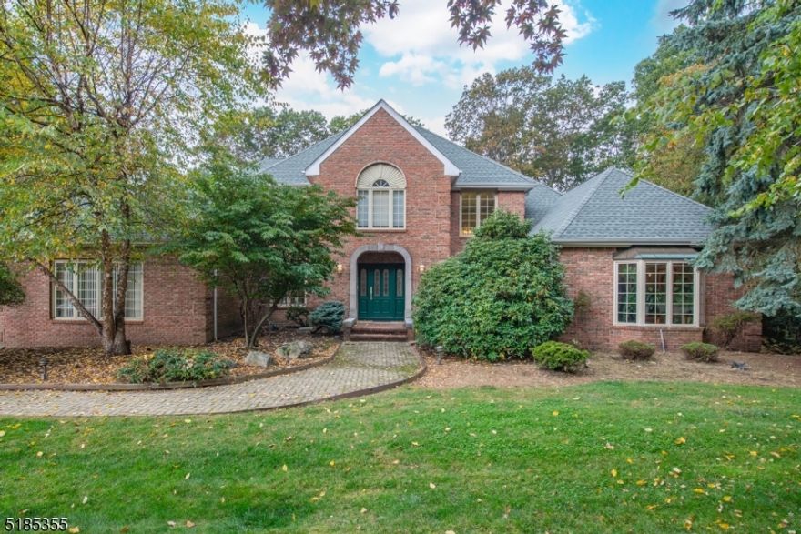 Nestled in one of Denville's most desirable neighborhoods, this home offers an upscale lifestyle on a quiet street. Expanded, custom floor plan. Almost 5000 sqft. A spacious home accented w/architectural details; high ceilings, high hat lighting, hardwood, marble & moldings. The formal dining area & large conservatory bookend the striking 2 story foyer. Formal living room with built-ins, window seats & wet bar! Cozy family room w/stone faced wood burning fireplace offers ENDLESS entertaining space. Nicely opens to the eat-in kitchen w/granite countertops, sub zero SS fridge & center island. Option to convert to natural gas cooking! Convenient powder room & laundry. Large windows throughout provide beautiful ambience & tons of natural light. French doors to 75 ft deck & private backyard. 1st floor bdrm w/bath & separate entrance. Upstairs, another TWO bedrooms w/ en-suites & walk-in closets. Including, the grand primary which offers the 2nd wood burning fireplace. 2 more generous sized bdrms, a full bath w/ tub & stall shower & sitting room/office complete the 2nd floor. Several options to work from home! Full, finished bsmt boasts a rec room w/billiards, exercise area, storage & utility room. Sliders to the backyard. 3 Car Garage. Great location, just minutes from Union Hills Shopping Center, Denville's bustling DWTN, Morristown Green, NYC-Direct transport & easy access to major hwys. Public utilities. Newer furnace (1-3 yrs) & roof only 9 yrs.
