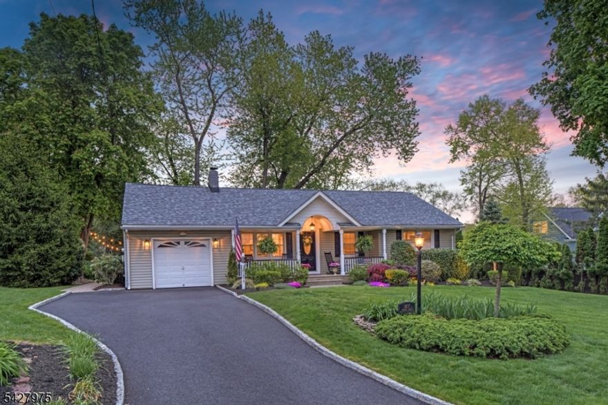 CAPTIVATING CURB APPEAL AT 1817 CHAPEL ROAD! This 3-Bedroom, 2-Bath gem is nestled in one of Scotch Plains' most sought-after neighborhoods, less than a mile from Tamaques Park and served by top-rated Scotch Plains-Fanwood School District. Delightful sitting porch sets the stage from the moment you arrive. Living Room impresses with attractive fireplace, crisp white mantel, and abundance of natural sunlight. Flow seamlessly into bright, open Family Room and Dining Room, graced by a soaring vaulted ceiling and glass slider to fabulous wood deck w/ outdoor speakers and luscious, green Backyard, the ideal setting for dinner parties, weekend brunches, summer bbqs, or cocktails with friends. Eat-In Kitchen is beautifully outfitted, displaying Silestone countertops, custom cabinetry, center island with seating for 3, large pantry, stainless steel appliances, and sunny dining or sitting area with its own slider to the deck, expanding effortless indoor-outdoor options. Single-level living is perfected here with 3 comfortable bedrooms, all boasting generous closets with double racks, and even a classic cedar closet. Two Full Bathrooms and pristine hardwood floors throughout, complete main level. Finished heated & carpeted L-Shaped Recreation Room, featuring surround music system offers an expansive retreat, ready for everything from a gym, family room or work suite; plus large Laundry Room, and gigantic unfinished storage room with potential space for whatever your vision inspires.