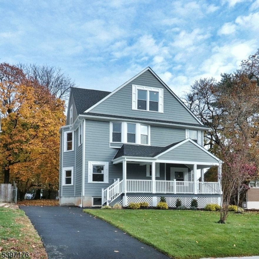 Experience unparalleled character and charm in this stunning renovated 5 bedroom, 4.5 bathroom Colonial residence, offering 5,500 square feet of sun-drenched living space on a deep and expansive property in the prestigious Seven Oaks section. Designed with an open-concept floor plan that includes bedrooms on the second and third floors, this home boasts gleaming Santos Mahogany oak hardwood flooring and is ideal for elegant and modern living. The gourmet kitchen is a chef's dream ensuring a top-tier culinary experience equipped with top-of-the-line Stainless Steel appliances, custom cabinetry, quartz countertops, and a waterfall edge center island. The master suite is a luxurious haven, featuring a roomy walk-in closet and a spa-like bathroom. Additionally, the second floor is accompanied by two generously sized bedrooms with a main bath. The third level consists of two other bedrooms and also boasts ample closets and share a well-appointed bath. The fully finished lower level is a private oasis designed for extended living featuring a large family room space which provides a perfect retreat for both entertainment and relaxation with its own private entrance. Every detail throughout this home has been meticulously crafted for comfort and convenience, offering an unparalleled blend of luxury and practicality in one of NJ's most sought-after neighborhoods less than a mile from the Transit train station.