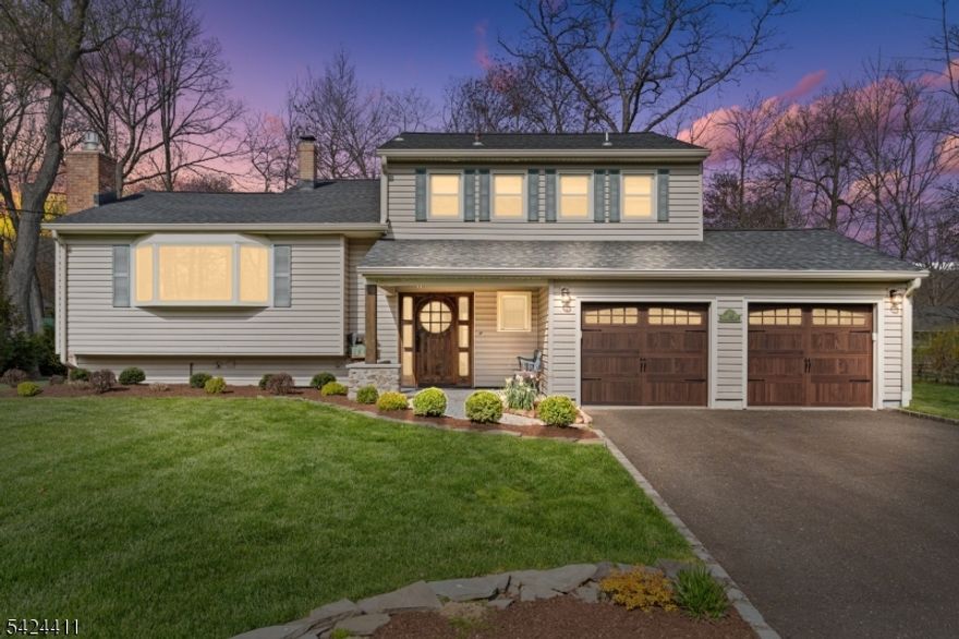 Welcome to this custom expanded split-level, anything BUT your average split! Set in a lovely neighborhood on a beautifully manicured grounds. Enter through the custom-made front door, a true piece of art, that immediately sets the tone for what's inside. From the moment you step in, the WOW factor is undeniable, w/ soaring ceilings in the LR & DR that create an open, airy feel & an impressive space for everyday living & unforgettable entertaining. A 2006 expansive addition elevated this home to the next level. The stunning, oversized dining room is made for memorable gatherings, while the beautiful eat-in kitchen flows seamlessly into the expansive family room. Both spaces offer sliders to the gorgeous patio, creating a seamless indoor / outdoor experience. From backyard BBQs & cozy nights by the fire to game days & large holiday celebrations, this space is built to enjoy it all. This level also features a magnificent primary suite complete w/ a WIC & a spa-like bath. Upstairs, you'll find 3 spacious bedrooms, all w/ custom closets, including one w/ its own en suite bath, great for guests or extended living. Extensive improvements include: Inside - 3.5 beautifully updated baths, flooring, railings, lighting, appliances, HWH, blinds, interior doors & hardware. Outside - roof, garage doors, underground sprinkler, & a gorgeous patio to name a few. 48 Hastings Rd is truly the total package - stylish, spacious, perfectly located & absolutely move-in ready!