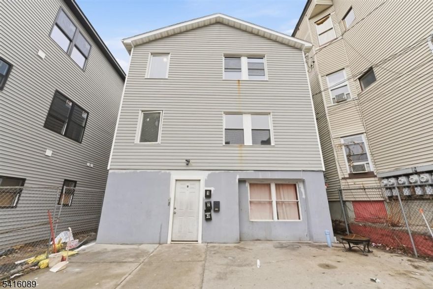 Welcome to this recently updated and well maintained three-family early 2000's build home located in the heart of Paterson, New Jersey. This property features a total of 12  bedrooms, three full bathrooms, and two of the three units having an additional half bath. This property's highlights include 3 well maintained units with functional layouts to help maximize rental income, seperate utilities, forced hot air, 3 new water heaters less than 2 years of age, large front and backyard spaces, and much more! 2nd floor will be delivered vacant, and 1 unit is expected to vacate by the end of May. This is your perfect investment opportunity for either landlords who want to house hack by living in one unit while collecting rent from the rest, or investors who want to add a low maintenance 3 family to their portfolio!