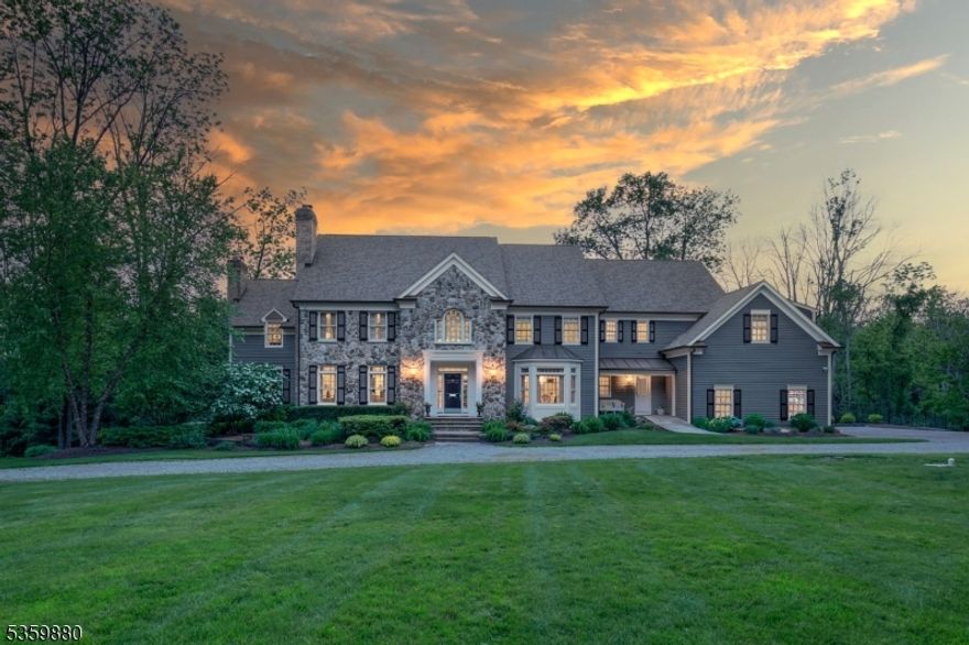 Privately nestled beyond a gated entry on one of Bernardsville Mountain's most coveted streets, this distinguished Bucks County-style Colonial offers timeless architecture and refined, updated interiors. Encompassing over 6,500 square feet plus a finished walk-out lower level, the home is both expansive and inviting.A gracious marble-floored foyer sets the tone for richly detailed living spaces where soaring ceilings, four fireplaces, and custom millwork evoke classic elegance. Recently refreshed with newly finished hardwood floors, designer lighting, and thoughtful updates, the home feels curated and current.Large windows frame views of 10 beautiful acres, drawing in light and connecting interior spaces to the pool, spa, and manicured grounds. The layout includes a vaulted family room, paneled library, butler's pantry, and spacious kitchen anchored by a 15-ft island ideal for everyday gatherings. The luxurious primary suite offers dual marble baths and a serene sitting room.With five bedrooms, multiple entertaining areas, and resort-like outdoor amenities, this is a rare opportunity to own a legacy home in one of New Jersey's most prestigious enclaves.