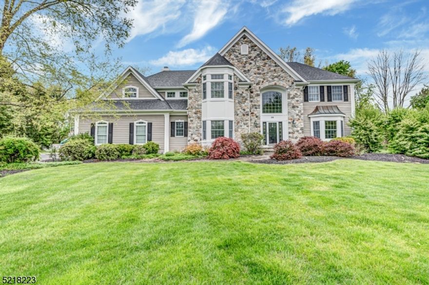 Set far on the cul-de-sac, this gorgeous & elegantly appointed colonial awaits you! A welcoming grand 2-story entry with frame molding, designer lighting, open balcony & gleaming floors. Architecturally graceful arched openings flow from the foyer into the living room w/ crown molding & column division into the formal dining room; perfectly adorned w/ tray ceiling & chair rail.  The joy of cooking is yours in the captivating gourmet kitchen; granite counters, stainless appliances, open & glass front cabinets, plenty of counter space including a desk station, center island w/ seating & separate dining area. Custom built-in cabinetry & columns divide the kitchen from a sundrenched step-down family room w/ fireplace & French doors opening to a lovely 3-season conservatory; perfect for entertaining w/ sweeping views of the property & easy access to the landscaped backyard w/ expansive paver patio & hot tub. French doors off the foyer provide privacy for the home office. A laundry, powder rm & 3 car garage complete this level.  5 bedrooms & 3 full baths on the 2nd flr include the spacious primary suite w/ double door entry, tray ceiling, walk-in closets & luxury bath w/ clawfoot tub, glass enclosed shower & 2 sink vanity.  2BRs share a Jack-Jill bath & a 1BR suite offers direct access to the main hall bath that also services a 5thBR.  Exquisitely finished lower level w/wet bar, rec room, playroom & half bath.  Great proximity to NYC Train station, Rts 287/78, shopping & schools.