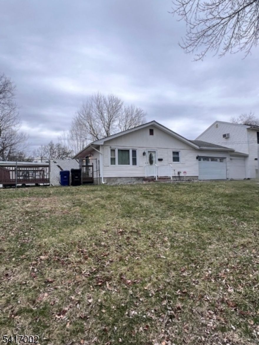 Well-maintained 3-bedroom, 1-bath ranch featuring a spacious living room with sliding doors that open to a large deck-perfect for entertaining.  Enjoy a bright, large eat-in kitchen and an updated bathroom.  The home also includes an attached garage for added convenience.  A must-see property at an unbeatable price.