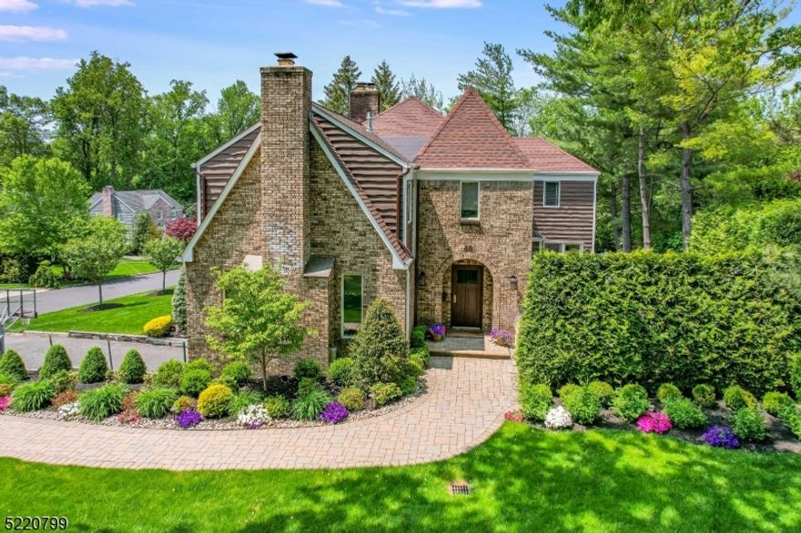 Stunning & immaculate Colonial w/extra large entry foyer, grand spaces, handsome hardwd flrs & rich crown moldings, in a sought-after, walk-to-town & train location. Impeccable style,  elegance & quality, many rooms freshly painted, new carpets & truly move-in condition. Surrounded by beautiful homes, lush landscaping offers complete privacy in front & back. 6 BR's on 2nd flr, skylit hallway & hall bath, deluxe primary BR suite w/vaulted ceiling, fireplace, huge walk-in closet, 9' wall of closets for shoes, custom built-ins, marble bath w/private commode & big steam stall shower w/rainhead shower + handheld spray. Amazing flr plan for entertaining w/over 100 recessed lights, built-in speakers, raised panel doors, all Andersen windows & Hunter Douglas shades/blinds. High ceilings give an open & airy feeling, gourmet, white eat-in kitchen w/huge center island breakfast bar, oversized Subzero refrig/full size freezer, 2 subzero drawers, icemaker, 2 Asko dishwashers, 2 sinks, 2 Wolf ovens, warming drawer, microwave, 6 burner gas stove, huge pantry opens to 1st flr laundry. Formal dining rm w/80 bottle wine cooler, built-in buffet makes serving a pleasure. Living room/coffered knotty pine ceiling opens to family room, both with fireplaces & lots of built-ins. Large breakfast rm & built-in bar overlooks tawesome patio w/fireplace, outdoor tv, summer kitchen & seating for everyone! Basement w/gym, 2 rec rms, 1/2 bath & fish tank. This home won't last - you cant just drive by!