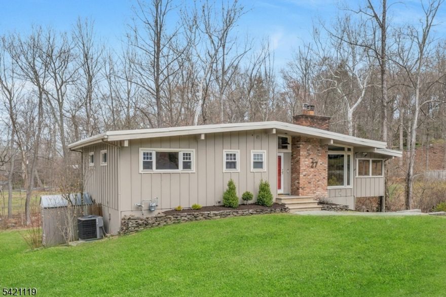 Step into this bright 2,400 sq ft contemporary ranch in one of Ringwood's most desirable neighborhoods, with optional membership to Cupsaw and/or Erskine Lakes. Set on 0.41 acres, the home offers a seamless layout across both levels, including a walk-out lower level that expands the living space and connects naturally to the outdoors.The main level features a living room with fireplace that flows into the formal dining area and kitchen with a casual dining space overlooking the deck and property. A large picture window brings in natural light and frames outdoor views.Enjoy dining or relaxing on the expansive deck overlooking a private, wooded setting with a natural stream.The primary bedroom includes a private half bath, along with two additional bedrooms and a full bath. Hardwood flooring runs throughout the main level.The walk-out lower level opens to the backyard, creating an easy transition to the outdoor setting. Ideal for a family room, home office, or recreation space, it also includes a full bath, laundry room and ample storage.Recent improvements include a new furnace and central air conditioning. The home also features a 200-amp electrical service with transfer switch and generator hookup. Ringwood is known for its natural beauty, with miles of hiking and outdoor recreation, state parks, and a strong sense of community all while remaining within easy reach of major roadways, shopping, and dining.