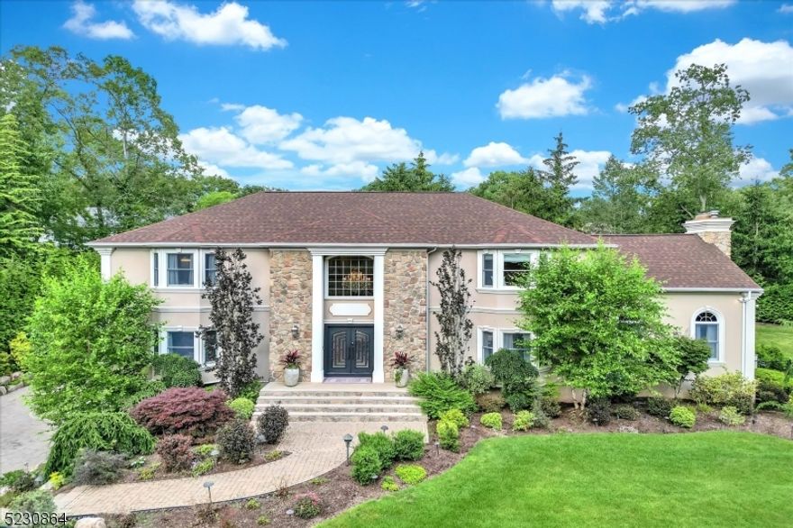 Introducing the Home You've Been Waiting For!Welcome to this extraordinary luxury colonial home, boasting 5 beds, 4.5 baths, and over 4,000 sq ft of exquisite living space. Situated on a beautifully landscaped property spanning over half an acre, this residence offers a world of tranquility, complete with an in-ground pool and a serene koi pond.Step inside and be greeted by a grand 2-story entryway that leads to the formal living room, spacious dinning room, and a chef's kitchen, featuring a custom-built bar, perfect for hosting and entertaining guests. The family room boasts lofted ceilings and a cozy wood-burning fireplace. On the first floor, you'll also find a bedroom with an en-suite bathroom, a laundry room, and a powder room.Retreat to the oversized primary suite on the upper level, offering a tray ceilings, walk-in closet, and a luxurious bathroom. Three additional bedrooms, along with a full bathroom complete the second floor.The fully finished basement is an entertainment haven, featuring a spacious recreation area, a sleek office with custom built-ins, and a full bathroom.  there you will also find a large study equipped with a bar, fireplace, and ample storage space.Enjoy the spaciousness of the 3-car garage, complemented by ample parking in the driveway. Tucked away in a private location, this home impresses with its generous size, and elegant features, lush lawn and blooming landscaping, providing an unparalleled living experience.