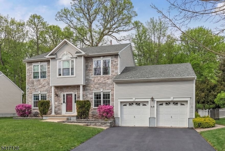 Location means everything and now your home search ends here! WELCOME to this beautifully designed and fully updated Colonial, situated on perhaps one of the most tranquil streets of THE PEAKS in Morris County. Move right in and enjoy the summer in your new home situated on a cul de sac surrounded by wooded privacy in the front and back. Be impressed by the recent high end upgrades here: NEW ROOF 2019, NEW WINDOWS 2023, NEW HOT WATER HEATER 2024 & NEW HVAC UNIT 2025. Step inside to a spacious newly painted OPEN FLOOR PLAN with elegant wide planked chestnut hardwood throughout the first level. Sunny kitchen shows off white cabinetry, designer quartz countertops, stainless appliances, large pantry and new glass sliders to deck. Convenient garage entry leads to laundry/mud room. Cozy wood burning fireplace is the centerpiece of the family room. Primary bedroom suite features dual walk-in closets and ensuite bath with skylite, dual sinks, soaking tub and shower. Second level displays rich wood laminate flooring throughout (no carpet to rip out!). Relax and have fun in the modernized basement, with luxury vinyl flooring and flex space for entertainment and storage. Enjoy the beauty of nature outside on the large newly repainted deck with Sunsetter retractable awning, paver patio and leveled fully fenced yard with backyard storage shed. PUBLIC UTILITIES are here, for worry free living year round. Close to all major roads, schools, shopping, lake activities and an easy NYC commute.