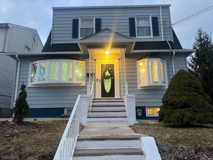 Captivating Colonial! Low Taxes! NYC Bus at your door! Fully renovated with exterior EV charging station, granite countertops, stainless steel appliances (refrigerator, microwave, stove). Lower level has separate entrance, bonus room with ensuite/in-law suite and summer kitchen. Fantastic faux fireplace and picture window in LR. Fabulous Formal Dining Room also with picture window. Laundry room with front loading washer and dryer included with sale. Two car garage. Plentiful parking at rear of house. Deep lot with expansive entertaining space. Mudroom at rear entrance. New roof overlay. Professionally waterproofed basement. Union, NJ is known for its convenient commutes to NYC, Newark Airport, GSP, NJTP, Rts 22, 78 and 1&9, excellent educational institutions, i.e., Kean University, suburban feel with urban advantages, fun festivals, engaging events, walkable downtown with charming coffee shops and a growing repertoire of well-regarded restaurants, plentiful parks, safe and cordial community with a delightful diaspora. Easy to see/show any day, but don't delay or this deal will get away!!!