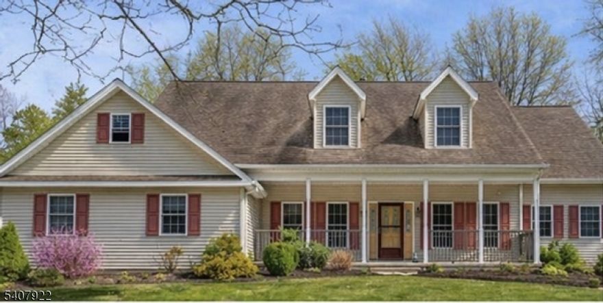 Tucked away on a serene, wooded lot, this home offers the perfect blend of privacy and thoughtful design. A highly desirable first-floor primary suite delivers effortless living, while the dramatic two-story great room steals the show with a soaring stone fireplace that stretches all the way to the ceiling. The custom kitchen is both beautiful and functional, flowing into a cozy breakfast nook ideal for slow mornings and casual meals. Step outside and unwind on one of two covered porches perfect for morning coffee, evening gatherings, or simply soaking in the peaceful surroundings.