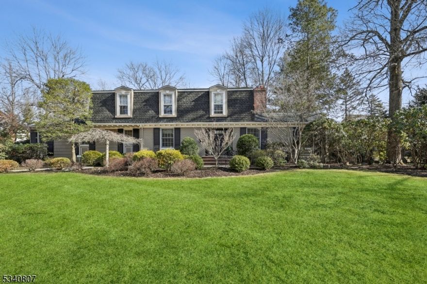This spectacular mint condition Colonial is ideally located on a quiet street in the highly desirable Poet section of Short Hills, just a 0.6 mile walk to Hartshorn Elementary School & 1.2 miles from Gero Park & the Town Pool. This 6 bedroom 4 full bath Colonial features a stunning newly renovated gourmet eat-in kitchen with center island, quartz countertops, top of the line Thermador appliances, walk-in pantry, lighting fixtures over eating area w/ easy access & great views of expansive patio & totally level, fenced property, w/ plenty of room for a pool. The kitchen is totally open to family room, for a great open floor plan. The back of the house is south facing, w/ large windows, so the home gets tremendous natural light. Huge 1st level in-law suite w/ a newly renovated full bath, + 2 more bedrooms on 1st level share a gorgeous newly renovated full bath. Easy 1st level access to attached 2-car garage. 2nd level features a luxurious primary bedroom suite w/ walk-in closet, spa-like bath w/ copper soaking tub & shower. 2 additional bedrooms share a gorgeous newly renovated bath. Beautifully finished lower level w/ rec room & laundry. Ideally located on .53 acres of totally level, fenced property, that extends 45' behind the green giants in the backyard. Plenty of room for a pool on a quiet street walking distance to Hartshorn Elementary School! Many amenities including new HVAC systems, mostly all new thermal windows, relined chimney & new gas hot water heater. Low taxes!