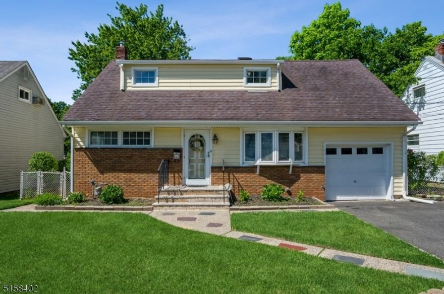 Well-maintained home, private back yard, excellent location! Spacious four-bedroom, one-bathroom Cape home sits on a manicured lot on a quiet street in Union. Just seventeen miles from Manhattan, this home is conveniently located near two golf courses, a downtown area with numerous restaurants and stores, the Garden State Parkway, Kean University, and New Jersey Transit with direct trains to Penn Station. The interior of this warm and welcoming home features an open layout, hardwood floors, crown molding, and bright and sunny rooms. The living room has a bow window letting in lots of natural light. The flow continues to the dining area with a charming stained glass window and a sun-filled kitchen with stainless steel appliances. From the kitchen, step outside to the patio overlooking a fenced-in back yard with a lush, green lawn, several mature shade trees, and a storage shed. The first floor also includes a large primary bedroom with a walk-in closet and a full bathroom in the hallway. On the second floor are three additional good-sized bedrooms, one with a skylight, and ample closets. The unfinished basement offers a laundry room, extra storage, and potential to expand your living space.