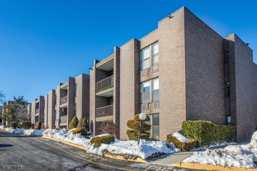 CHARMING 2 BEDROOM CONDO IN NUTLEY! This move in ready 2 bedroom, 1.5 bath, one-floor condo offers convenience and a fantastic location! Enjoy cooking in the updated kitchen with granite countertops and newer stainless steel appliances. Relax in the bright living and dining area with sliders that open to your private balcony, perfect for morning coffee or unwinding at the end of the day. This home features 2 spacious bedrooms, updated full bath, a convenient half bath, in unit washer and dryer and plenty of closet space throughout. Fireplace is decorative only. Not functional.  You'll also appreciate the private storage bin in the basement, a designated outside parking space and access to the pool for summertime enjoyment!  Commuters will love the NYC bus stop located just outside the complex entrance, along with easy access to major highways, Clifton Commons, shopping and dining. Nutley is a highly sought after town that offers quiet community living with nearby urban conveniences. With approximately 1,020 square feet of living space, prime location, spacious rooms and desired amenities, this beautiful condo is the one you have been waiting for! A home and lifestyle not to be missed!!