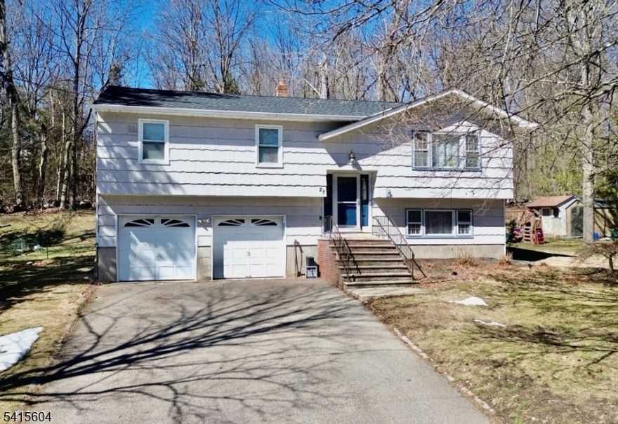 Welcome to 27 Caro Drive nestled on a quiet residential street in the desirable Oak Ridge section of West Milford. This beautifully well maintained 4 bedroom, 2 bath bi-level home offers comfort, space, and thoughtful upgrades throughout. Set on nearly half an acre, the home provides both privacy and room to enjoy outdoor living while still being close to local shopping, dining, and major commuting routes. The main level offers an inviting living area, dining space, and kitchen, along with generously sized bedrooms and a full bath. The lower level expands the living space and features additional rooms perfect for a family room, home office, or guest accommodations. Recent improvements add peace of mind and modern style, including a brand new roof installed in 2024, updated vinyl flooring throughout the lower level in 2025, upgraded electrical panel, newer carpeting, new appliances, newer windows, natural gas heating, and much more. A must see!