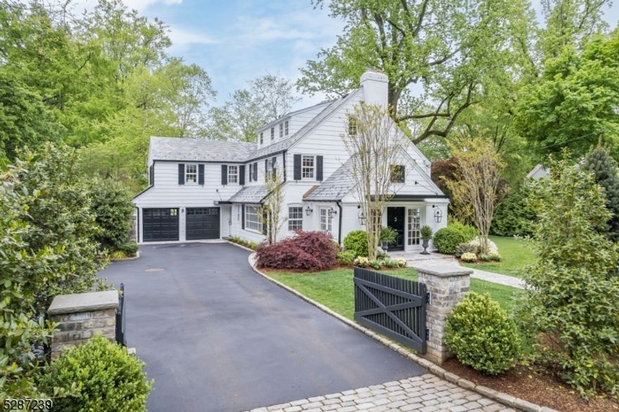 6 Bed, 4.2 Bath located on quiet storybook, horseshoe street in Old Short Hills! True lifestyle home w/ stunning renovations tastefully blend timeless character w/ chic Manhattan style. Bevolo Gas Lamps adorn a custom front door guiding to Foyer w/ vaulted black beadboard ceiling & large Living Room w/ deep original stone fireplace, partially beamed ceiling, dentil crown molding. Family Room w/ modern beamed ceiling, & Dining Room w/ wainscoting. The gourmet Eat-In Kitchen is every chef's dream w/ large island or custom dining nook. Quartz countertops, Wolf & Sub Zero appliances, Paonazzo Italian black-veined & white marble backsplash & walk-in Pantry make this Kitchen the heart of the home. On the 2nd fl you'll find the Primary Bedroom w/ custom Walk-In Closet & luxurious NEW Primary Bathroom w/ double marble vanity & oversized exposed pipe double shower. With 3 more large bedrooms, including 1 en-suite, NEW Full Hall Bath & NEW laundry area, this house blends luxury & convenience. The 3rd fl has 2 large bedrooms & Full Hall Bath. The LL is finished & perfect for entertainment & has a Laundry Room, Powder Room, "Costco bulk storage Pantry  & wine cellar for 90 bottles, and more. Wow factor continues outside w/ lush, manicured landscaping and two large bluestone Patios with Maryland stone fireplace & extraordinary Outdoor Kitchen w/ Argentine wood fire grill, Blaze gas grill & XL Kamado Joe smoker and pizza oven gas hook-up. 1.8 miles to train & 0.3 miles to Glenwood School.