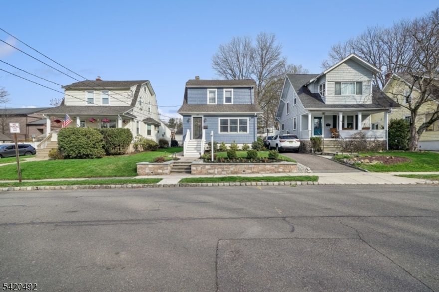 Welcome to this pristine 4-bedroom, 2.1-bath Colonial located in one of Verona's most desirable neighborhoods! From the moment you arrive, you'll appreciate the meticulous curb appeal and beautifully landscaped grounds. Step inside to a welcoming vestibule perfect for starting and ending your day. The inviting living room flows seamlessly into a fabulous home office, featuring a custom glass sliding door, charming built-in shelving, and remote-controlled blinds. The updated, spacious kitchen opens to a large dining room and flows effortlessly into the sunlit family room, creating the perfect layout for everyday living and entertaining. From here, step outside to an expansive deck and patio overlooking an entertainer's dream backyard. Upstairs, you'll find four generously sized bedrooms and a beautifully renovated full bath. The primary suite offers vaulted ceilings, a large walk-in closet, and a stunning en-suite bath. The finished basement provides excellent additional living space, complete with a recreation area, custom storage shelving, laundry room, and a half bath. A detached garage offers incredible flexibility ideal for storage, hobbies, or even a potential home gym. Conveniently located near top-rated schools, parks, and Verona's vibrant downtown, this home truly offers the best of community living.