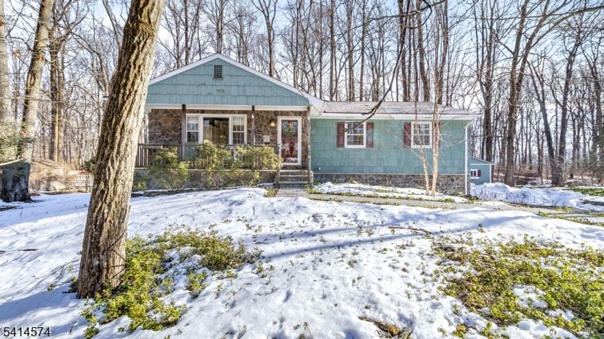 ** Highest & Best due by Tuesday 3/10/26 by noon ** Located in a quiet cul de sac neighborhood, this warm & inviting 3 Bedroom/2 Bath Ranch is bursting with charm.  From the rocking chair front porch to custom oak peg style flooring, architectural beams & raised hearth stone fireplace the ambience of simpler times prevails.  Updates include a modern  bathroom with walk in shower(2020), remodeled kitchen with oversized pantry, double ovens & dual sinks (2019), new chimney liner & gas insert for fireplace (2019), roof (2019) & hot water heater(2018).  The partially finished basement with access to 2 car garage can be used as a rec room, office or gym & includes laundry, storage room & another pantry.  Enjoy nature & privacy from the 2 tier deck or take a quick drive to the bustling river towns of Milford or Frenchtown for long walks along the Delaware, shopping or dinner.  Public Sewer, natural gas, bucolic views and local farm stands await!