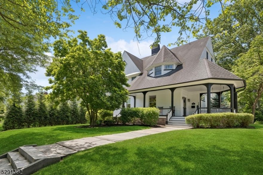 Nestled in the charming heart of town, this gloriously updated 6br, 5.1ba Victorian exquisitely blends modern amenities with original craftsmanship and detail. Entering the foyer from the expansive lemonade porch, you are greeted by an abundance of natural light. The sophisticated living room connects to open plan dining room, family room & gourmet kitchan replete with custom cabinets, carrera marble countertops, Viking applicances and wet bar. French doors lead to deck and lushly landscaped yard. Primary suite sanctuary boasts gas fireplace, expansive en suite bath & custom closet/dressing area. Completing the 2nd level are 2 add'l brs, spa like main bath, and laundry room. 3rd level presents 2 brs and add'l bedroom suite. Finished lower level offers large rec room, exercise area, full bath, utility room & storage. Detached garage features Tesla charger. Garage sold AS IS.