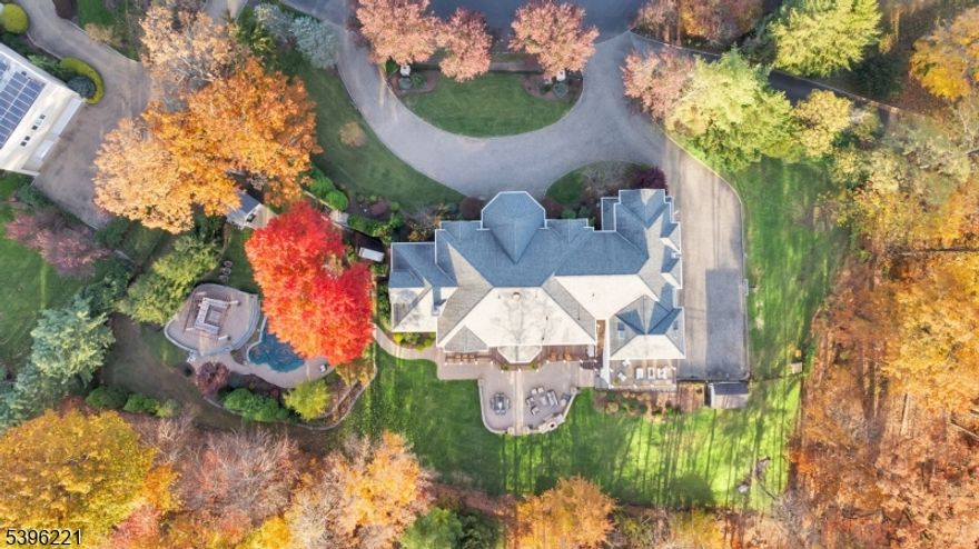 Nestled at the end of a cul-de-sac in Watchung, this 10,000+ sq ft residence embodies refined living on 1.3 acres of complete privacy. Designed for both comfort and grandeur, it blends timeless architecture with sophisticated modern updates throughout. Inside, you?re welcomed by six fireplaces, dramatic ceilings, and exquisite millwork. The chef?s kitchen features a la Cornue range, double ovens, large center island, heated floors, and its own fireplace?perfect for chef-level cooking and everyday warmth.The expansive primary suite is a sanctuary of nearly 1,800 sq ft with a sun-filled sitting room, two walk-in closets, a romantic fireplace, and a private balcony overlooking the serene grounds. The walkout lower level offers a movie theater, sauna, gym, cocktail lounge, and a large recreation area opening to a heated saltwater pool and backyard oasis.a newly added top-floor living space provides versatility for a guest suite, home office, or creative retreat, while a brand-new deck enhances indoor-outdoor living.With 5 bedrooms, 6 full baths, and 2 half baths, every detail was crafted to inspire. Ideally located near Rt. 78 and Rt. 22, and minutes from Summit, Long Hill, and Dunellen train stations, this exceptional home offers easy NYC access plus top-rated schools, premier shopping, dining, and everyday conveniences