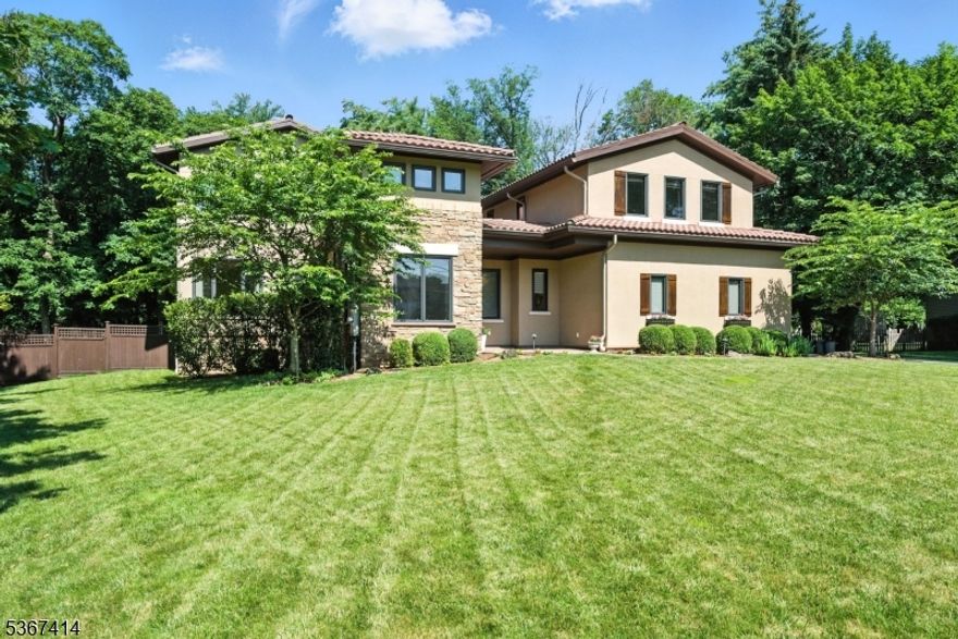 Nestled in one of Morris Township's most desirable neighborhoods, this breathtaking custom built home designed by award winning architect J Costantin, was built with inspiration, drawn straight from the hills of Tuscany. Timeless architecture, rich textures, every detail evokes a sense of old world charm and modern sophistication. Layout, elegant archways , soaring ceilings, 20 zones of radiant heat including basement and garage, exquisite hardwood floors throughout, recessed lighting, 4 zones of central air, court yard with fireplace, outdoor patio with the works, and an oversized 3 car garage are just a few of the amenities this home has to offer.  Just start by walking into the foyer with custom vaulted tongue & groove ceiling, oversized windows down the hallway & double French Doors to the open courtyard w/stone fireplace & center stone furniture table surrounded by oversized windows! The heart of the home, a Chef's Kitchen w/high end appliances, a walk-in Pantry & separate Butler's Pantry w/Wine Fridge and plumbing for a coffee maker. A sun-drenched Great Rm w/French Doors to outside patio w/built in barbecue and plenty of entertaining space! Upstairs there are 4 bedrooms plus the primary oversized Master Suite w/Full Bath, Walk-In Closet, Sitting Area, & doors that open to a Large Deck Balcony. Jack & Jill bathrooms. Custom staircase to lower level w/finished Basement + Full Bath, Play Rooms, Office & Rec Room. A  rare opportunity to be close to Morristown & the train!