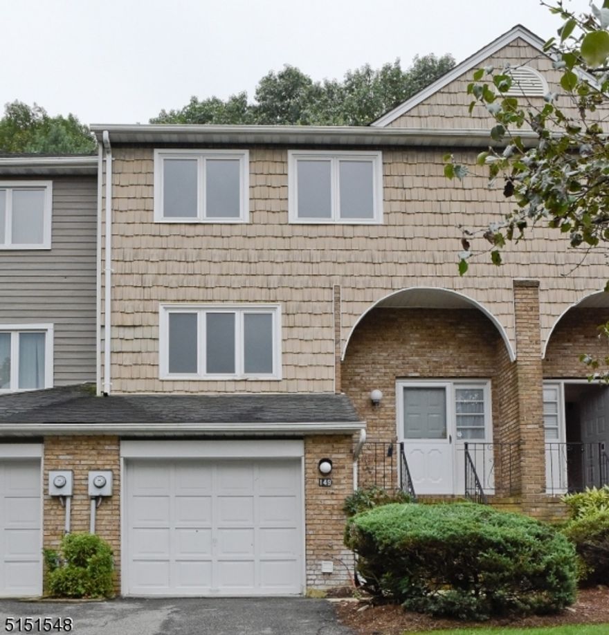 Rare to find townhome with Living and Family/Recreation rooms on main floor. This completely updated townhome has Living and Family/Reccreation rooms on main floor. The main floor includes an eat-in kitchen with SS appliances, a formal dining room, large family/recreation room, large living room with solid hardwood floor, wood burning fireplace slidings onto the deck and a wooded back. Second floor offers Master Bedroom with Master bath & walk-in closet, 2 additional good size Bedrooms with another Full Bath. Full partial finished basement with Office room - perfect for an in-home office. Walk out basement to Garage to Outside. 1 Car Garage with driveway for 2 Cars. Good size Deck and private backyard. Recently updated kitchen with cherry color cabinets and steel appliances. Solid OAK hardwood floor in main level, New/er Kitchen, Bathrooms, Hardwood floor/Carpets, Association amenities include an In-ground pool, Tennis courts and Club house. Close Proximity to Shoppings, Major Highways & Public Transportation Train/Bus to NYC.Remarks:  Tenant is responsible for first $100 for each repair. Rental Application, Credit Reports, Employment verification, NTN Report and Rental insurance reqd. No Pets