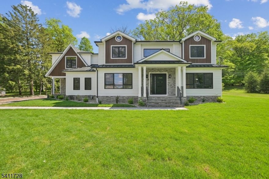 Commanding in presence and generous in scale, this custom-built 7 bedroom, 6.5 bath residence spans over 6,600 square feet in one of the town's most desirable settings. Designed for those who value both privacy and impact, the home delivers space with intention. The main level is layered and expansive, offering distinct yet connected rooms that allow life to unfold naturally. A formal living room and dining room set a refined tone, while the family room anchors daily living with warmth and ease. The kitchen is substantial and sophisticated, finished with custom cabinetry, quartz surfaces, premium stainless steel appliances and a statement island built for gathering. A private first-floor in-law suite and dedicated office create flexibility for guests or focused work. Upstairs, five generous ensuite bedrooms offer comfort and proportion. The primary suite feels set apart, designed as a true retreat. Laundry is thoughtfully positioned on the second level for convenience. The fully finished lower level, enhanced by nine-foot ceilings, expands the home's versatility with office, recreation and guest space, complete with a full bath.This is a home defined by volume, privacy and quiet luxury.