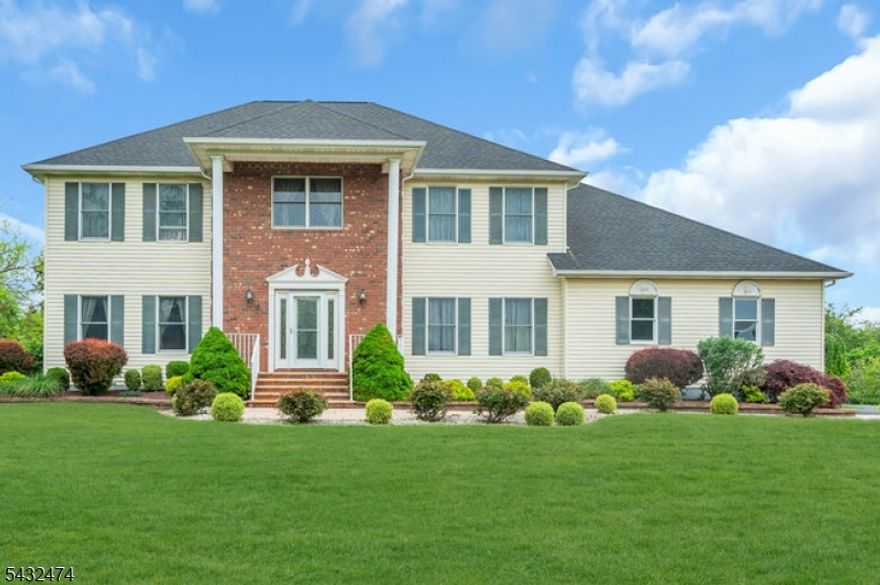 Sprawling center hall colonial nestled on slightly over 2 private acres at the end of a quiet cul-de-sac! Offering approximately 3,526 square feet of living space, this beautifully maintained four-bedroom, three full bathroom home combines timeless design with major updates throughout. Hardwood floors (refinished Nov 2024). flow throughout the home, and the first floor was freshly painted in 2025. The updated kitchen, remodeled approximately 10 years ago, has granite countertops and SS appliances, opens to spacious family room and overlooks the rear patio, also updated 10 years ago, creating the perfect setting for outdoor gatherings. The first floor features a remodeled full bath completed in 2020 along with a den, ideal for guests, or a home office. Upstairs, the generous primary suite includes a stunning primary bathroom remodeled in 2024, while an additional full bathroom was tastefully renovated in 2023. A full unfinished basement offers endless possibilities for storage, recreation space, or future finishing.Major improvements include HVAC and hot water heater replaced six years ago, a French drain installed in 2010, whole house generator, and whole house water filtration system for added peace of mind. With its desirable cul-de-sac location, expansive property, and impressive updates, this exceptional home is ready to welcome its next owner! Exterior doors and garage doors replaced