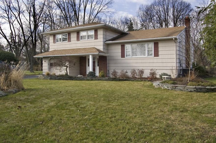 Beautifully Renovated Colonial with Timeless Elegance and Modern Comforts " Walk to Schools!This exquisitely updated Colonial blends understated elegance with today's modern conveniences, all just a short stroll from local schools. Perfect for entertaining, the expansive front-to-back Living Room features a cozy fireplace, while the spacious Dining Room easily accommodates large gatherings.The stunning, fully renovated Kitchen is a chef's dream, boasting upscale appliances, new dish washer, custom cabinetry, and a striking wall of windows that overlook the serene backyard. The Great Room offers flexible space to suit your needs, and the sunlit Family Room with its wall of windows creates an inviting space for relaxation and casual get-togethers.A full bathroom and well-appointed Laundry Room on the main level provide ideal functionality, especially for easy pool access.Upstairs, retreat to the luxurious en-suite Primary Bedroom, accompanied by three additional generously sized bedrooms all with ample closet space and abundant natural light. Every bathroom in the home has been tastefully renovated with style and quality in mind.Outside, enjoy a lush yard featuring a private 20' x 28' deck and a sparkling pool secured by a solid Loop Loc safety cover. A level lawn play area is thoughtfully separated from the pool zone.With hardwood floors throughout, fresh paint, and meticulous maintenance, this home is truly move-in ready.