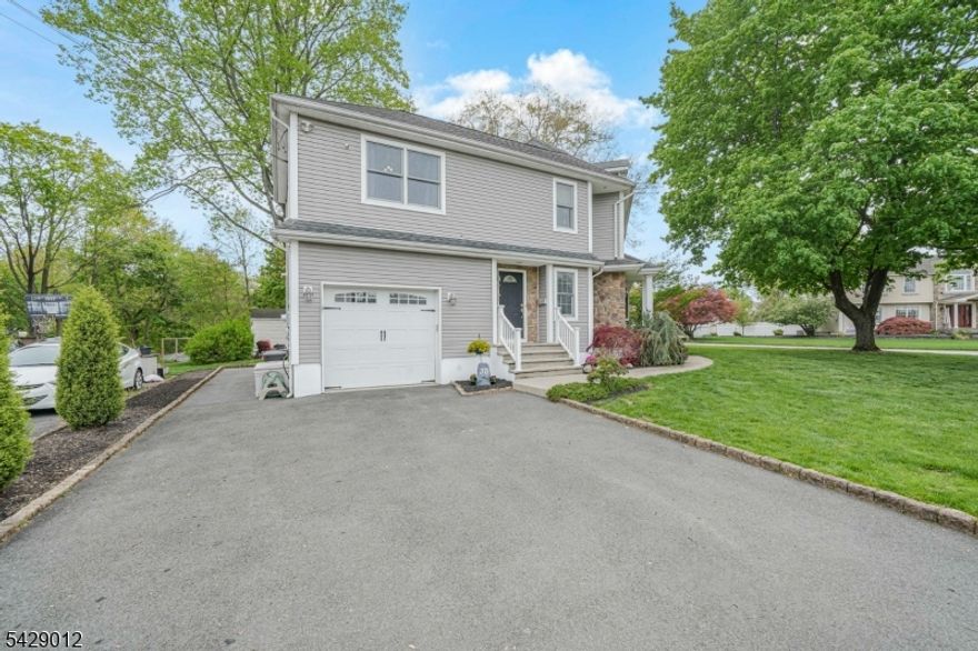 Welcome to 30 Oakley Way in Wayne NJ, a custom expanded 3,384+ sq ft home designed for elevated living and exceptional entertaining. Set on a rare corner lot with frontage on two streets, this unique property offers flexibility for potential second driveway or detached garage/parking setup. The dramatic great room features exposed beams, soaring ceilings, wood-burning fireplace with gas ignitor, and full entertaining bar with sink and beverage fridge. Heated-floor cabana/pass-through room includes second bar sink, stereo hookup for outdoor TV/speaker system, nearby powder room, and seamless access to Trex deck with newer PVC railings, hot tub, gazebo, and 4 access points. White shaker kitchen with granite countertops, stainless steel appliances, copper hood, coffee/prep bar, and vinyl plank flooring. Hardwood floors through most of first level. Flexible first-floor office/gym. Spacious primary suite with vaulted ceilings, walk-in closet, and spa-like bath. Second full bath with Jacuzzi tub. Additional oversized bedrooms, upstairs office, and second-floor laundry. Finished basement plus storage/utility space. 1-car garage with loft. 2-zone heat/CA, Mitsubishi split, 4 electrical panels, sprinklers fed by well, roof/furnace 2008, condenser 2025. Private rear setting backing Hamilton Park and Preakness Valley Golf Course. Zoned for Fallon Elementary, Anthony Wayne Middle, and Wayne Valley High School. Near NYC transit, shopping, parks, and highways.