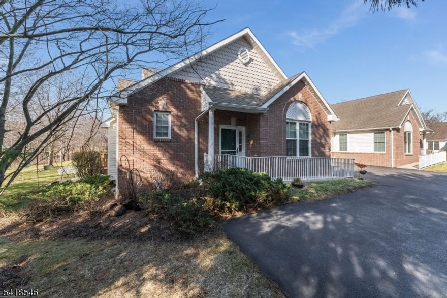 Enjoy relaxed, low-maintenance living in this beautifully maintained Daisy I end-unit townhouse located in the sought-after age-restricted community of Flemington Fields. Ideally positioned close to the clubhouse yet offering exceptional privacy, this home features a private deck overlooking wooded land, creating a serene setting to unwind and enjoy nature. One of the home's most desirable features is the first-floor primary bedroom suite, perfect for single-level living. The suite includes a tray ceiling, spacious walk-in closet, and a neutral, well-appointed bath. The main level offers an open and comfortable layout with a generous living room featuring hardwood flooring and a gas fireplace with elegant mantle and marble surround ideal for cozy evenings. The dining area flows seamlessly into the kitchen and is enhanced by an open view to the loft above, adding light and open-ness. The kitchen is thoughtfully designed with 42-inch upper cabinets providing ample storage. Upstairs, a guest bedroom, full bath, and versatile loft offer comfortable space for visitors, hobbies, or a home office. A full basement provides abundant storage. Recent updates include hardwood flooring, new furnace (2023), water heater (2024), dishwasher (2023), and new windows and storm door (2023) offering comfort and peace of mind. Convenient to shopping, dining, and community amenities, this home is priced to sell and ready for carefree living at its best.