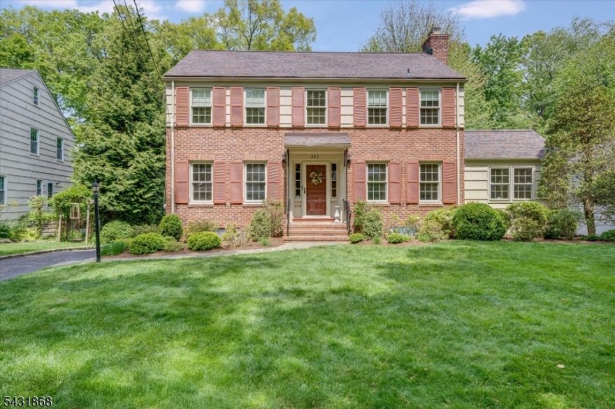 Set on a quiet cul-de-sac just steps to Glenwood Elementary School   one of New Jersey's highest-rated elementary schools   and direct New York City trains, this classic brick-front center hall colonial offers the perfect blend of location, lifestyle, and updates. Featuring 3 bedrooms and 2.5 baths, the home has been thoughtfully refreshed with newly refinished hardwood floors in a beautiful light blonde tone, freshly painted interiors, and a bright, welcoming feel throughout. The inviting layout offers comfortable living and entertaining spaces filled with natural light and timeless appeal. Step outside to a spacious deck overlooking the beautiful, level one-third-acre property with well-appointed landscaping and plenty of room to relax, play, and garden. A new roof and attached two-car underneath garage add both convenience and peace of mind. Ideally located near the scenic trails and nature programs of Cora Hartshorn Arboretum and Bird Sanctuary, this is a rare opportunity in one of the area's most sought-after neighborhoods with top-rated schools, parks, downtown, and commuting options just moments away.