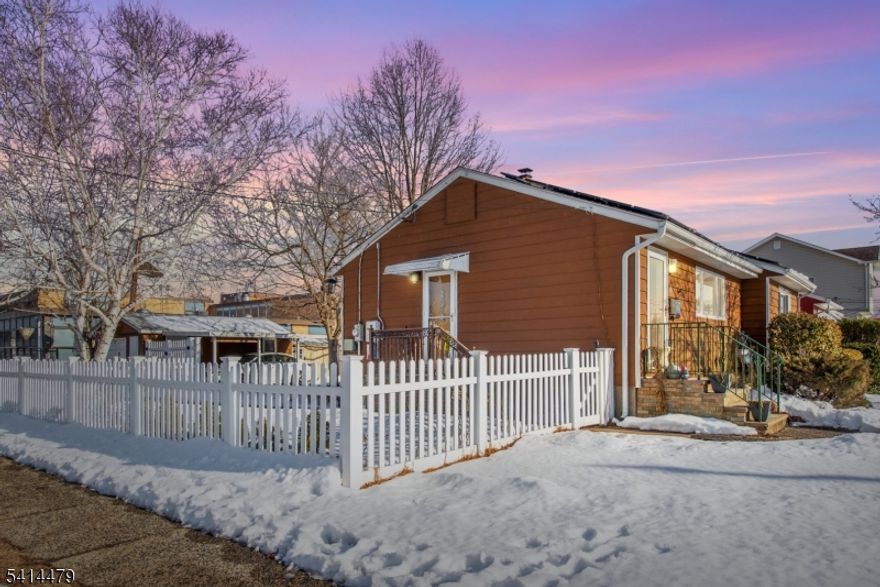 Discover this inviting ranch-style home in the heart of town, a location celebrated for convenience, community, and everyday comfort. Nestled on a generous lot with beautifully maintained outdoor space, this property is ideal for anyone who values both comfort and location. Step inside to a bright and open living space with original hardwood floors that add character and warmth throughout. The functional layout flows seamlessly from the living room to the kitchen, offering plenty of natural light and a space perfect for everyday living and entertaining. Central Air for added comfort. The home features multiple well-sized bedrooms (one with its own bathroom), while additional living space awaits in the finished basement, offering versatility as a recreation room, home office, gym, or hobby area. Outside, enjoy one of the largest yards in the neighborhood, perfect for summer barbecues, gardening, play space, or outdoor relaxation. A private driveway and detached garage provide ample parking and storage, a rarity in this area. Just steps to Long Memorial Elementary School directly behind the property. Close to local parks, playgrounds, and outdoor recreation Minutes to major highways including Route 80 and Route 46, easy commute to NYC, shopping, and employment hubs. Near a variety of restaurants, cafes, and retail amenities. Quick access to public transportation. This home offers a blend of location, value, and lifestyle in a thriving community.