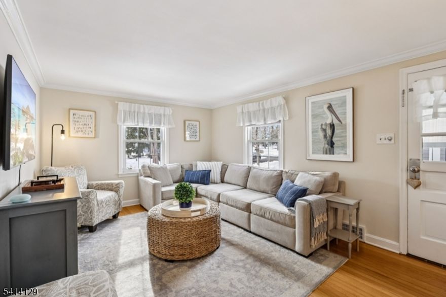 Welcome to 17 Cherokee Rd, a beautifully maintained 4 bedroom, 1.1 bath Cape Cod in Cranford's desirable Indian Village. Captivating details welcome you into an entry vestibule that opens to a sun-filled living room featuring hardwood floors and a seamless flow ideal for everyday living. The eat-in kitchen showcases stainless steel appliances, quartz countertops, with plenty of room for dining. Just beyond, a bright and airy three-season porch lined with windows overlooks the private backyard, offering the perfect spot to enjoy morning coffee or unwind in the evening. The first floor also includes two versatile bedrooms, along with a full bath featuring a walk-in shower. Upstairs, you'll find two additional generously sized bedrooms and a convenient powder room, providing flexibility for guests or evolving needs. The partially finished basement has been refreshed with brand-new carpet and fresh paint, creating additional living space ideal for a recreation room or playroom. A one-car attached garage adds convenience and extra storage, and the home is equipped with a tankless water heater for added efficiency. Outside, the private backyard oasis is perfect for gardening, relaxing, or hosting gatherings, complete with a dedicated gas line for a BBQ grill. Conveniently located near downtown shops, dining, parks, and transportation, this special home offers the perfect blend of timeless charm, modern comfort, suburban tranquility, and commuter-friendly convenience.