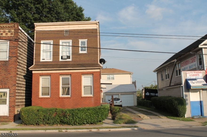 This two-unit home is looking for its next owner to truly make it their own. Each unit features two bedrooms and one full bathroom, offering flexible living options for owner-occupants or investors alike. The property includes a private two-car-wide driveway, a detached garage and a fenced backyard ideal for outdoor enjoyment, storage or added privacy. Conveniently located near major highways, public transportation, shopping, dining and local amenities, this home offers both accessibility and neighborhood charm. Whether you're looking to live in one unit and rent the other or expand your investment portfolio, this Linden home presents a great opportunity with valuable off-street parking and outdoor space.