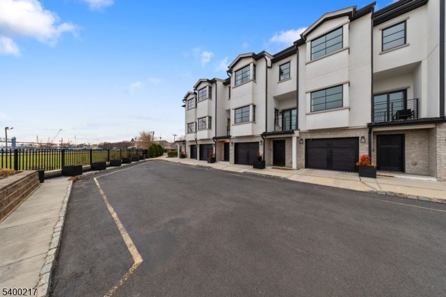 Welcome to this exceptional, nearly new modern contemporary townhouse, just 2 years young, offering the perfect blend of luxury, privacy, and functionality. This expansive residence features 3 spacious bedrooms, 3 full baths, 2 half baths, and a versatile first-floor den ideal as a guest room or 4th bedroom.Designed with an open-concept layout, the home showcases sleek modern finishes, oversized windows, and abundant natural light throughout. The chef-inspired kitchen flows seamlessly into the living and dining areas?perfect for entertaining or everyday comfort.What truly sets this home apart are the stunning, unobstructed waterfront views enjoyed from multiple levels, including the family room and upper-floor bedrooms. Because of the home?s thoughtful positioning, you?ll experience exceptional privacy along with the scenic outlook?something rarely found in waterfront communities.Located within a desirable gated community, residents benefit from convenient amenities including a playground just a comfortable distance away?close enough for enjoyment, yet far enough to maintain peace and privacy. A two-car garage provides secure parking and extra storage space.Experience modern luxury living with space, light, privacy, and breathtaking views?all in a prime location. Don?t miss the opportunity to make this extraordinary townhouse your new home. Visit today!Property Being Sold in AS IS Condition