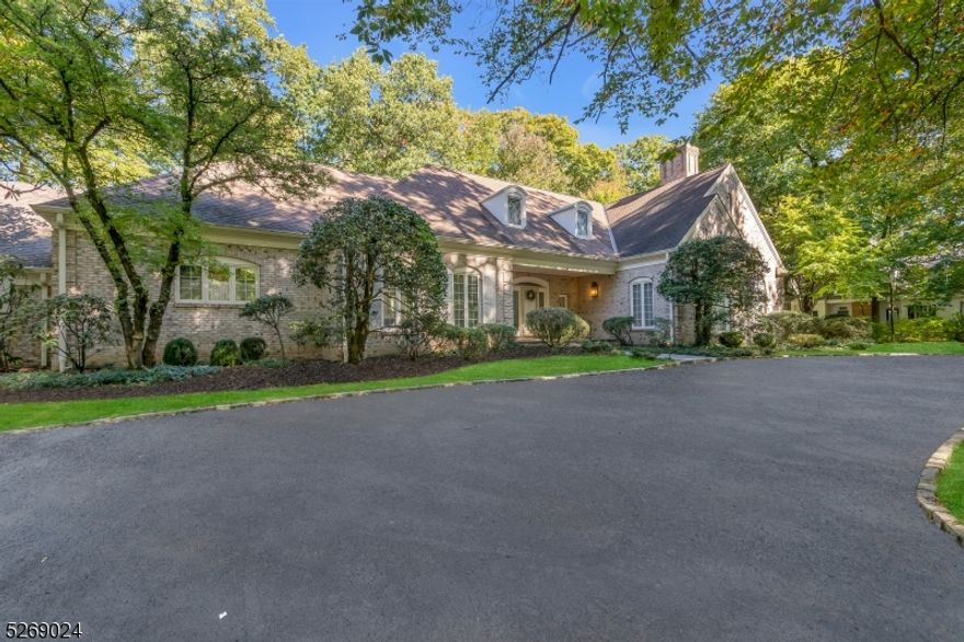 Welcome to the epitome of elegance on a sought-after street in the Hill section of Madison.  Sitting on almost 1.5 wooded and level acres, this Country French home boasts 4 bedrooms, 3 full baths, and 3 half baths.  The grandeur unfolds with two magnificent living rooms featuring soaring ceilings and wood-burning fireplaces, complemented by an inviting eat-in kitchen, expansive first-floor master suite, and a welcoming guest bedroom with ensuite. The second floor offers two additional bedrooms, accompanied by a full bath and ample space for expansion.  An oversized 2 car garage, mudroom, and sunroom add to the functionality of the home.  Delve into the possibilities of an expansive dual-entranced unfinished basement with half bath, stretching the entire length of the home.  A rare opportunity to renovate and create your dream home just a short walk from Madison's vibrant downtown and midtown direct train.  Home is being sold "AS IS . All room sizes are approximate.