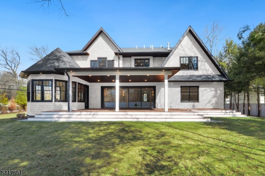 Set in the heart of River Vale, New Jersey, 803 Marshall Road presents a one-of-a-kind new construction defined by bold design and elevated craftsmanship. From the moment you arrive, the home impresses with striking curb appeal and a thoughtfully designed exterior.Inside, white oak flooring and abundant natural light complement soaring 10-foot ceilings and an open, airy layout. The chef-inspired kitchen features a quartzite island, high-end appliances, a spacious pantry, and refined finishes. A rotunda-style dining area offers sunset views, while a 25-foot sliding glass door creates seamless indoor-outdoor living, opening to an expansive deck.The main level includes a bedroom, office, and two full bathrooms, offering flexible living options. Upstairs, the primary suite features coffered ceilings, a custom walk-in closet, and a spa-like bathroom. Three additional en-suite bedrooms and a bonus room provide versatility for a variety of uses.The lower level offers approximately 2,500 sq ft with high ceilings, ready to be customized. Conveniently located near parks, shopping, and transportation, this home offers a rare opportunity in Bergen County.