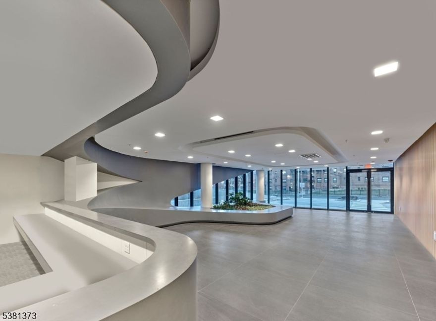 The Allure of Allure-luxury high rise building, built in 2021. Full service doorman building. Ideal for commuters with shuttle service to both Brick Station and Penn Station. The building boasts a state of the art fitness center, lounge area, party room for entertaining and roof top garden. The modern kitchen and bathroom features top of the line appliances and high end finishes. Washer and dryer are in the unit. Secure parking on site. Other size units and floor plans are available.