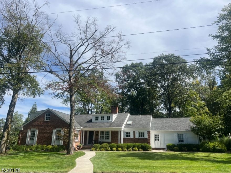 Extraordinary residence on sought after Cayuga Way in desirable Short Hills. Completely updated in 2011 for the current owners, this fine residence has a stunning living room with a fireplace a new kitchen, state of the art library, 2 additional bedroom suites on the second level, recessed lights & gleaming hardwood floors throughout. Amazing lower level with 2 oversized recreation rooms with a glazed concrete floor, large gym and powder room.