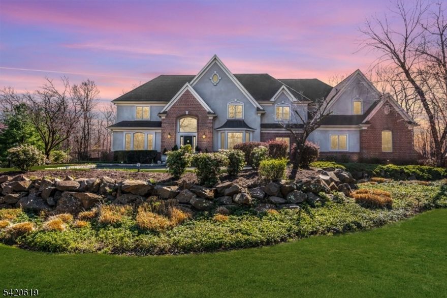 Set at the end of a private cul-de-sac, this exceptional home is a true statement of elegance, scale, and refined design. Perfectly positioned on a flat, manicured property with sweeping views from nearly every room, this 5-bedroom, 3 full and 3 half bath home offers luxury living at every turn. A grand two-story foyer with custom millwork and rich porcelain tile sets the tone, leading to beautifully curated living and dining spaces and a sun-filled family room designed for both everyday living and upscale entertaining. The gourmet kitchen features extensive cabinetry, premium appliances, a large center island, and seamless flow to the dining area and outdoor access, creating the perfect setting for gatherings both intimate and grand. The primary suite serves as a luxurious private retreat with a spa-like bath & dual walk-in closets, while the remaining bedrooms are generously sized, including one additional en-suite ideal for guests. The fully finished walk-out basement elevates the home with a fitness area & sauna, office, versatile workspace, & expansive recreation & lounge areas with direct outdoor access, offering exceptional flexibility for today's lifestyle needs. The flat backyard & serene setting provide endless possibilities for outdoor entertaining, recreation and relaxation all while enjoying privacy & picturesque surroundings. A rare opportunity to own a home where design, function, & luxury come together effortlessly.
